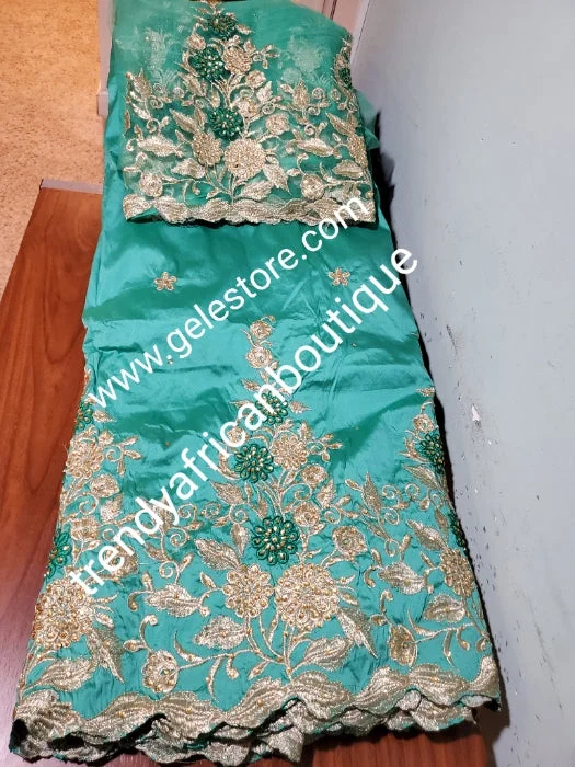 Mint green/gold  embriodery stone taffeta silk George fabric. Top quality Indian-George for making Nigerian/African party dress. 5yds George + 1.8yds matching net blouse. Contact us if you are interested in Aso-ebi order Budget-friendly party dresses