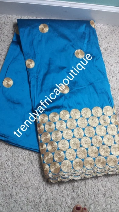 Hot sale! Original quality indian Embroidery Silk George wrapper for Nigerian party dresses. Indian-george. Beautiful turquoise Blue/gold embroidery design. Sold per 5yds. And price is for 5yds. Feel the difference in Quality!! Modest party dresses